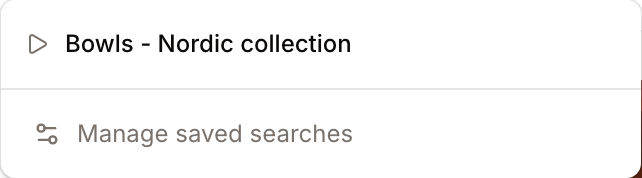 The Saved searches menu open, showing a saved search ready to load